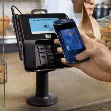 Member using contactless pay on a credit card terminal using a Diamond Valley Visa Card and Mobile Pay.