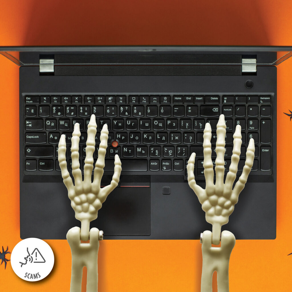 A skeleton hands typing on a computer.