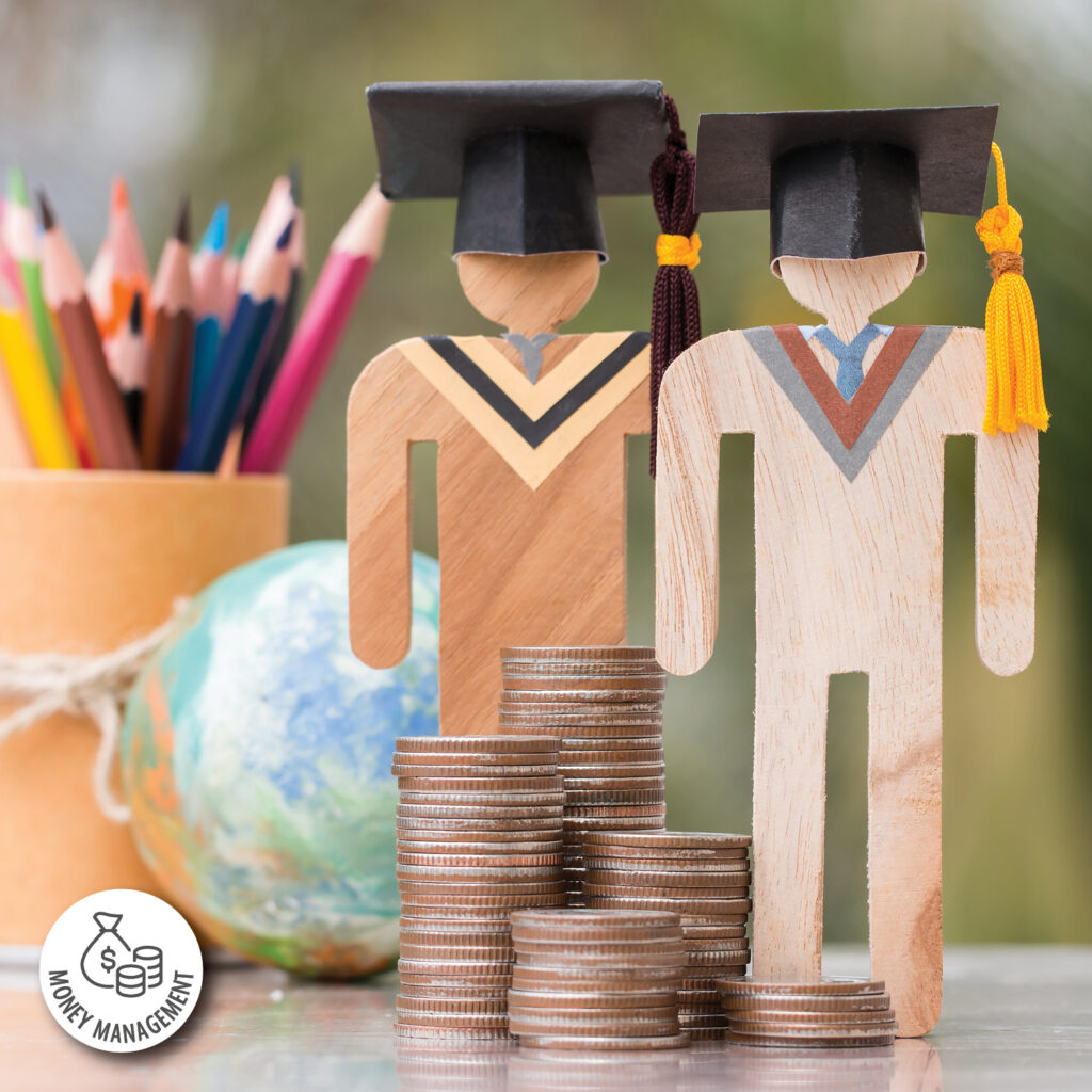A group of wooden figures with graduation caps and stacks of coins