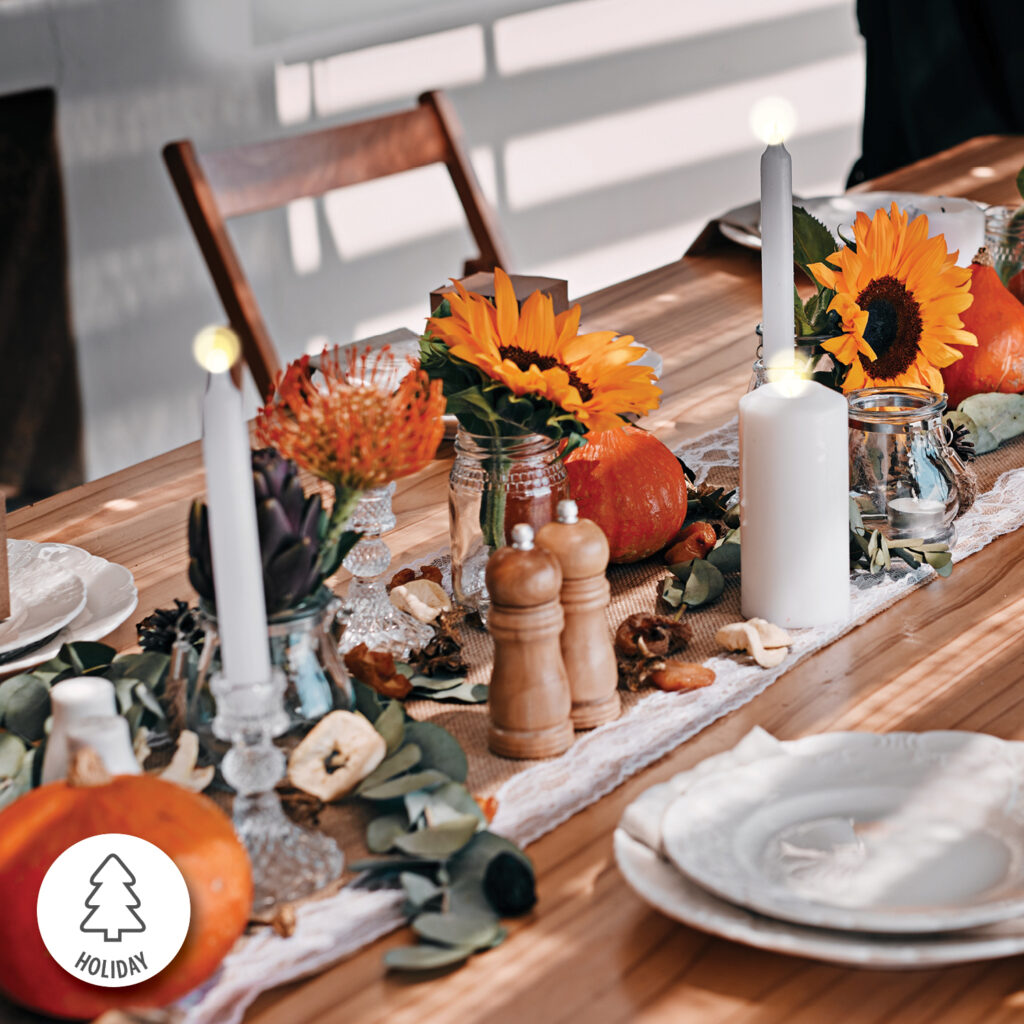 A table with candles and flowers