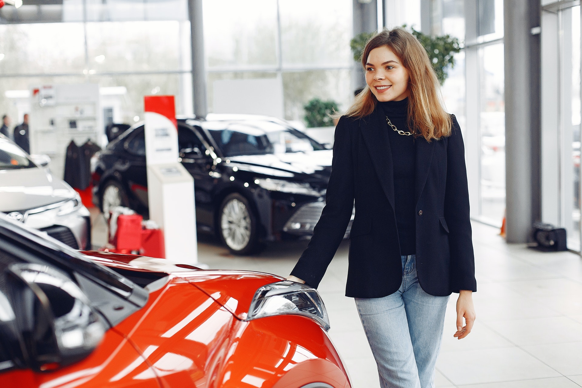 A person standing next to a car