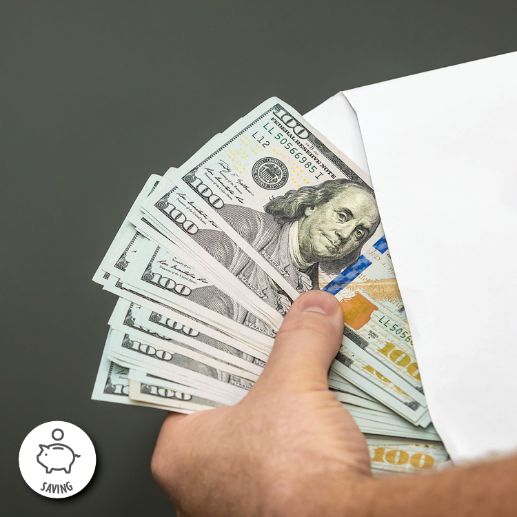 A person holding a stack of money